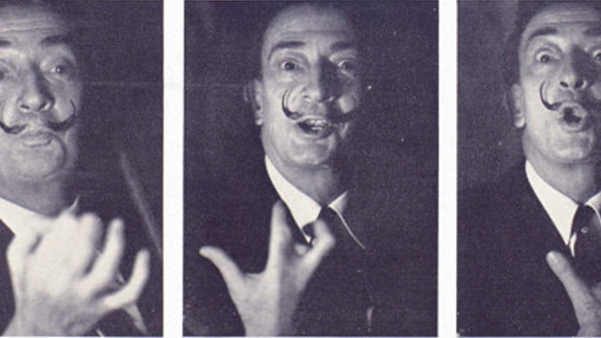 Salvador Dali making three different faces.