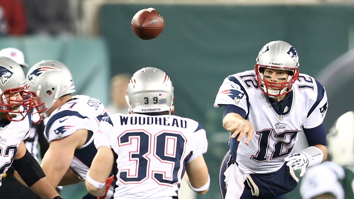 EAST RUTHERFORD, NJ - NOV 22: New England Patriots quarterback Tom Brady (12) throws the ball to running back Danny Woodhead (39) against the New York Jets at MetLife Stadium on November 22, 2012.