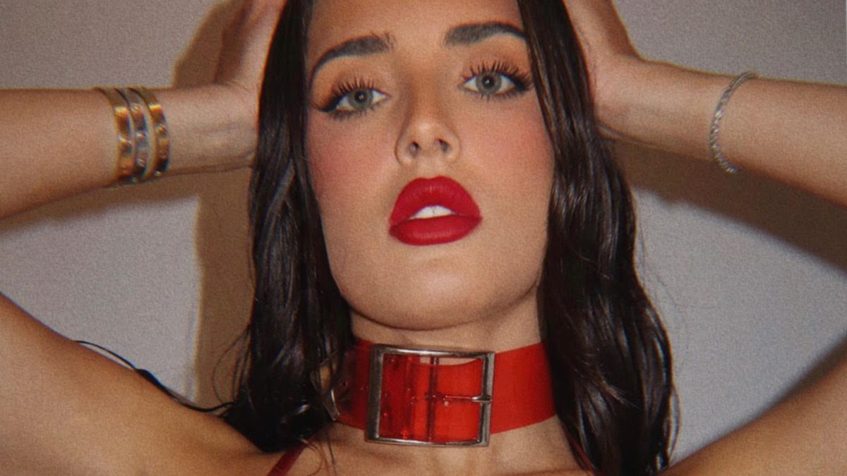 Sumner Stroh wearing a red choker.