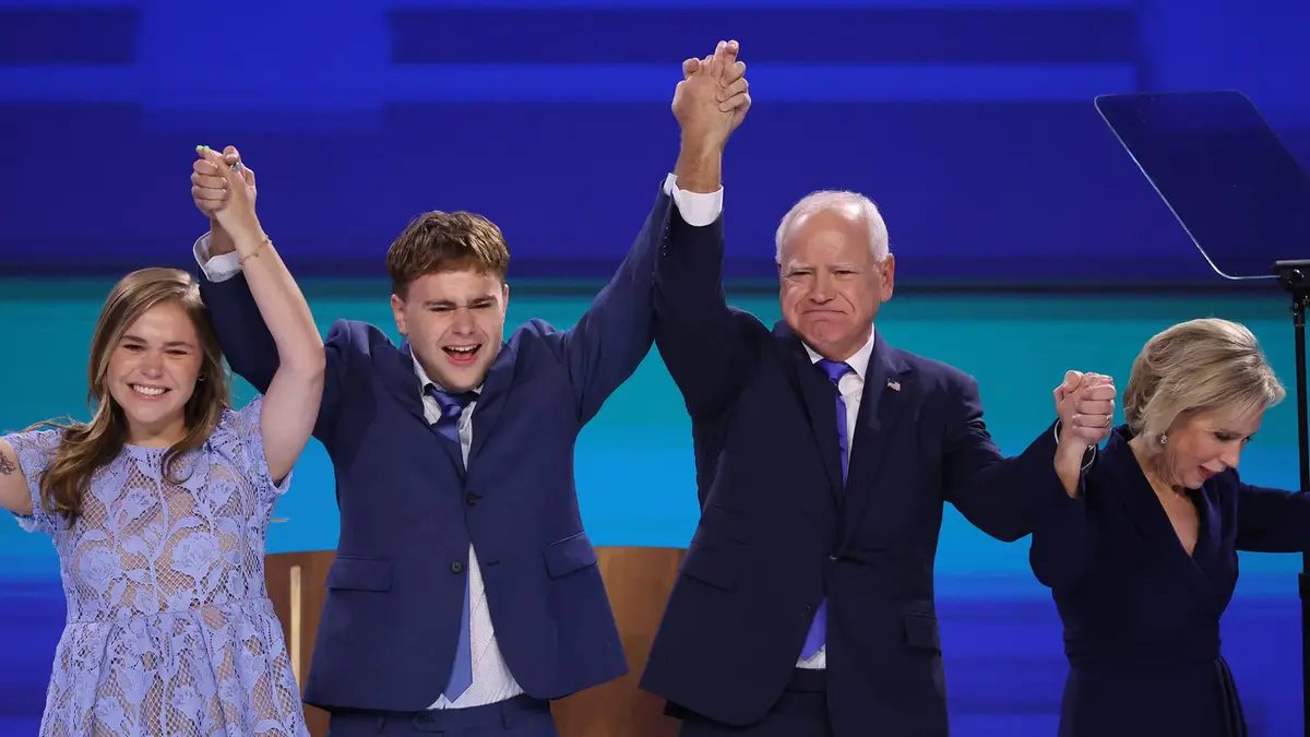 August 22, 2024: Democratic vice presidential nominee Minnesota Gov. Tim Walz waves to the crowd with his family after speaking at the Democratic National Convention at the United Center in Chicago on Aug. 21, 2024