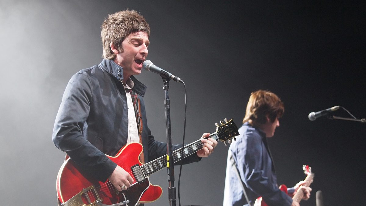 Oasis Noel Gallagher s High Flying Birds playing on stage.