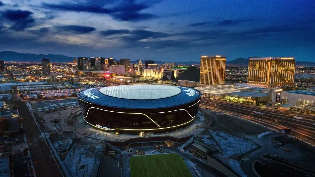 Allegiant Stadium with the Las Vegas Strip looming behind.