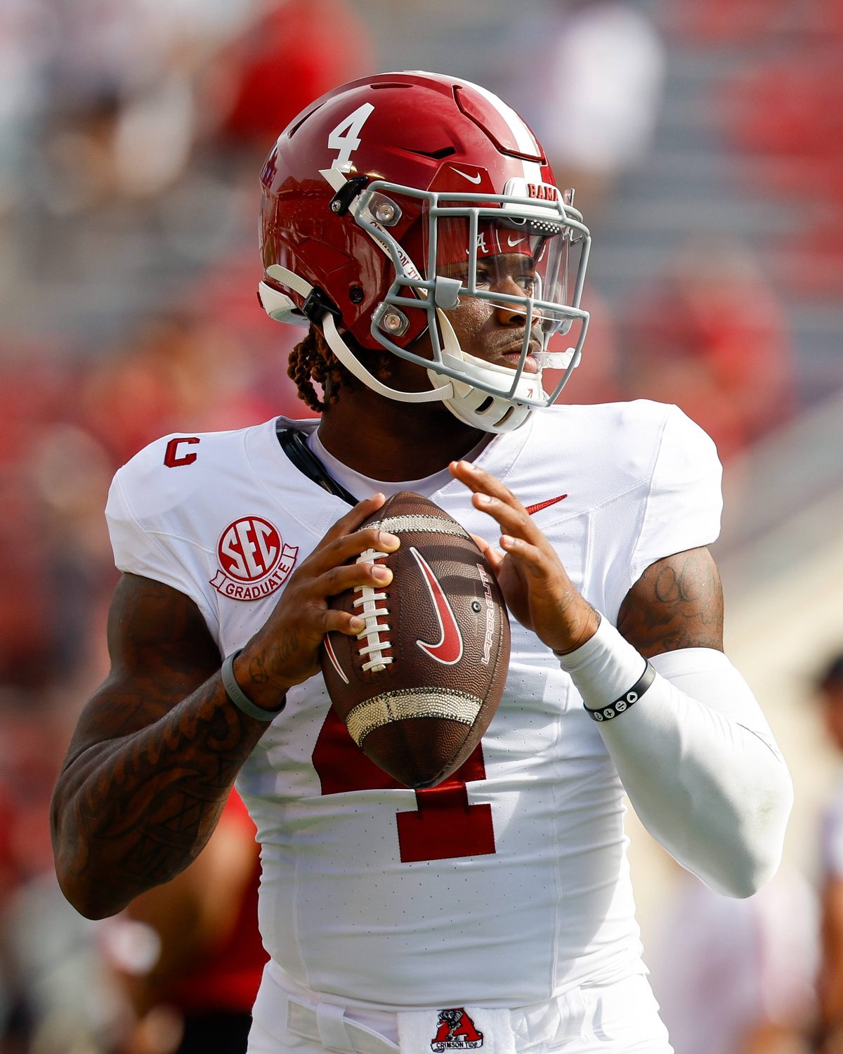 Alabama Crimson Tide quarterback Jalen Milroe (4) goes through his warm up routine.