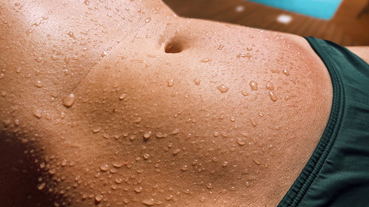 woman's glistening abdomen